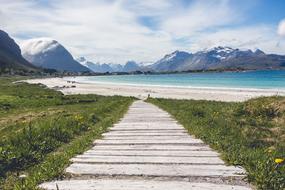Boardwalk to Beach in view of scenic rocky coastline