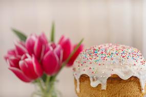 Easter cupcake and a bouquet of pink tulips