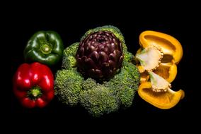 Colorful, beautiful, fresh and ripe vegetables at black background