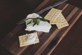 crackers with cream cheese as an appetizer