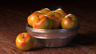 yellow apples in a metal bowl