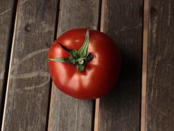 Wooden table and tomato