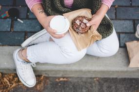 Sitting Person with Coffee in hand