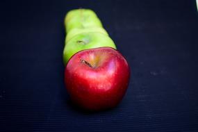 row of green and red apples