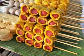 Close-up of the colorful street food with skewers