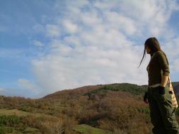 young girl on the background of the mountain