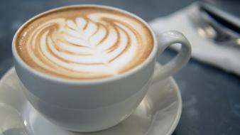 Coffee Latte in a white cup in a blurred background