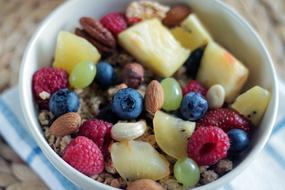 breakfast with fruits in a white bowl close-up