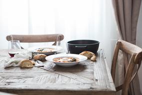 wooden chairs near the set table