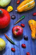 vegetables and fruits on a blue wooden table