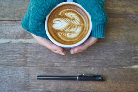 Brown Coffee Latte and pen