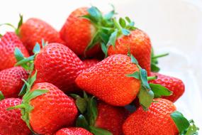 ripe strawberries on white background