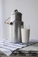 metal can and a glass of milk