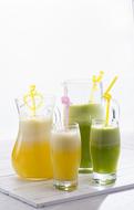 Beautiful and colorful fruit juices in glasses in light