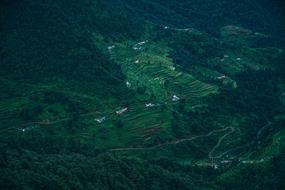 Beautiful landscape of the mountains with green plants and buildings, in Asia
