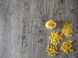 variety of pasta on a wooden surface