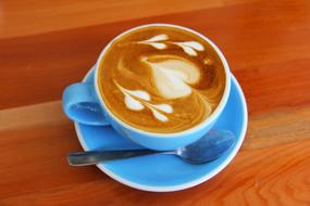 blue cup and saucer, coffee with beautiful foam