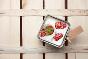 creamy dessert with strawberries on the table