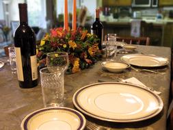 served table with a bottle of red wine for a holiday