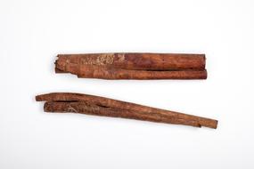christmas cinnamon sticks on white background