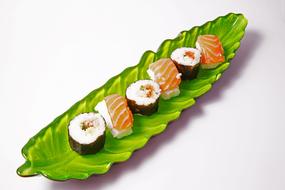 sushi rolls on leaf plate