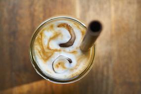 iced coffee in a glass with a straw