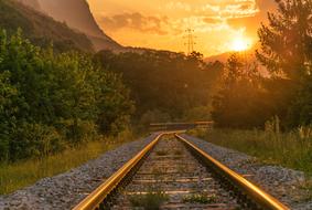 railway against the backdrop of the bright evening sun