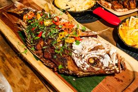 Colorful food with meat and vegetables, on the wooden board