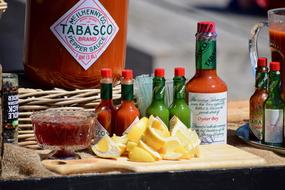 Tabasco sauces and lemons on the counter