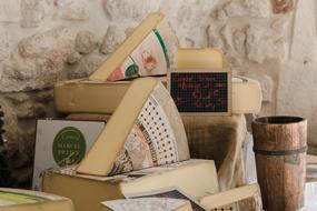 cheeses on the counter in the store