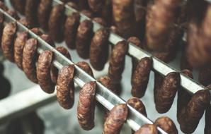 Traditional Smoked sausage on stand, meat Food