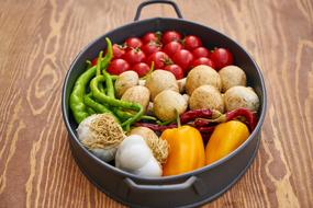 fresh vegetables in a mold on the table