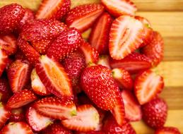 chopped strawberries on a cutting board