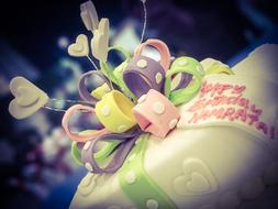 Cake with pastel decorative elements in a blurred background