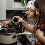 children preparing dessert in the kitchen