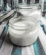 Coconut Oil White in glass jars on the table