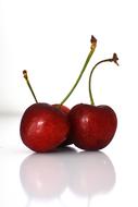 reflection of cherries on white glass