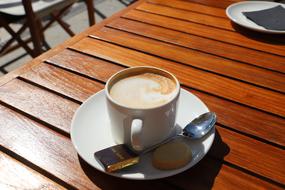 cup with coffee on a wooden table