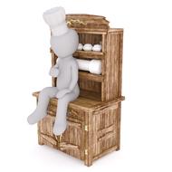 model of a chef sitting on a wood cabinet