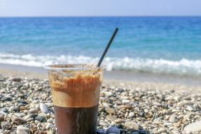 Coffee glass on Sea beach