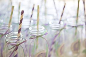 empty bottles with striped straws