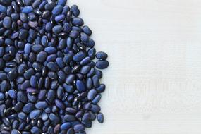Close-up of the beautiful, blue beans on the white surface