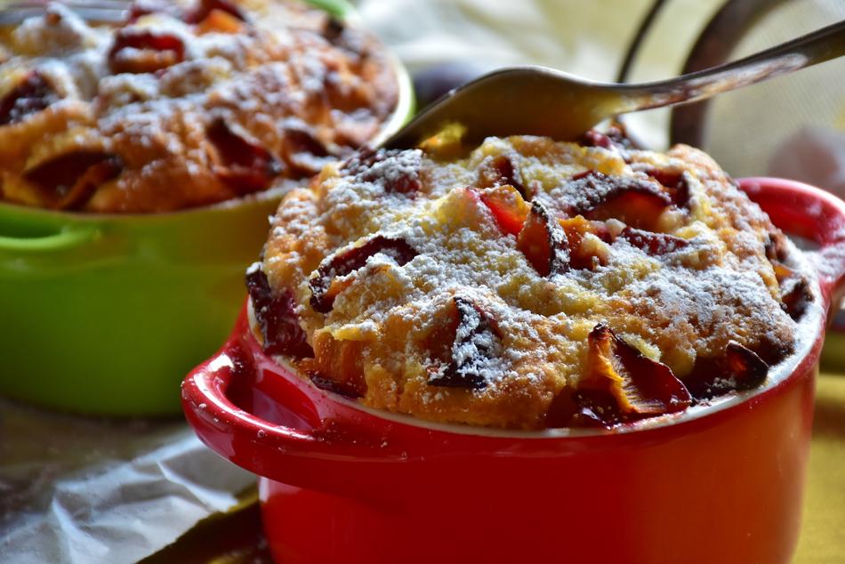 Colorful and beautiful plum cakes in the colorful bowls