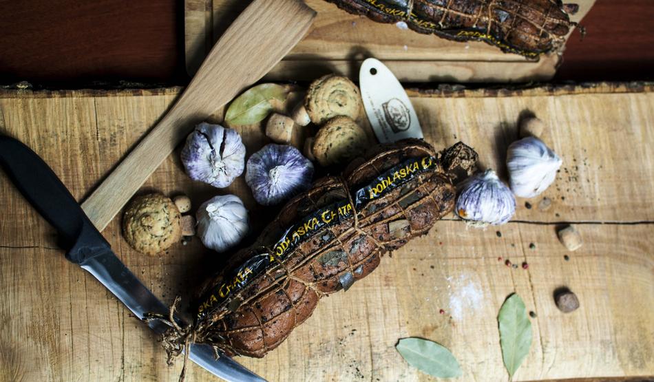 smoked sausage meat and garlic on the table