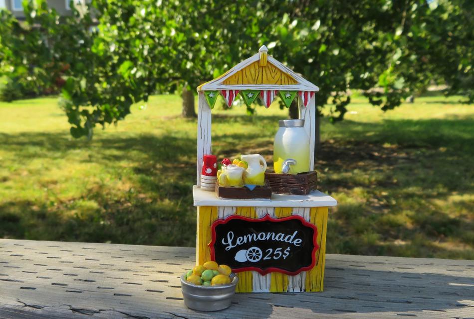 Colorful and beautiful lemonade stand on the path, among the colorful and beautiful plants