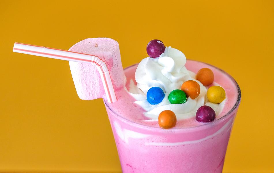 pink milkshake with straw