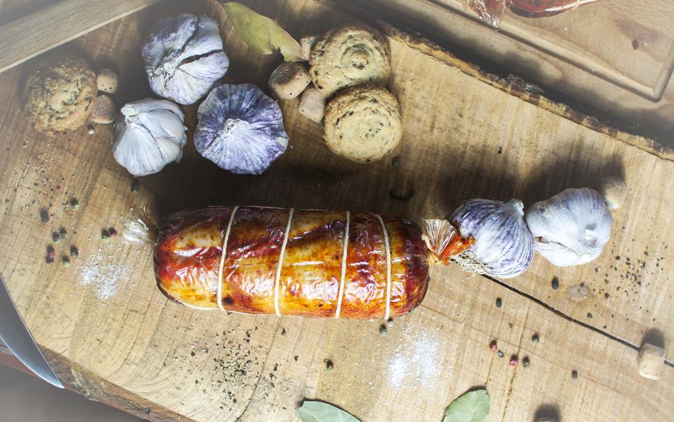 traditional smoked meat and garlic on the kitchen table