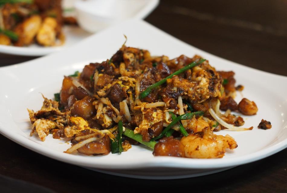 Colorful and beautiful, Malaysian food on the shiny, white plates