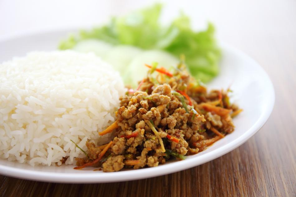 Close-up of the colorful and beautiful Kua Kling with rice and lettuce on the plate
