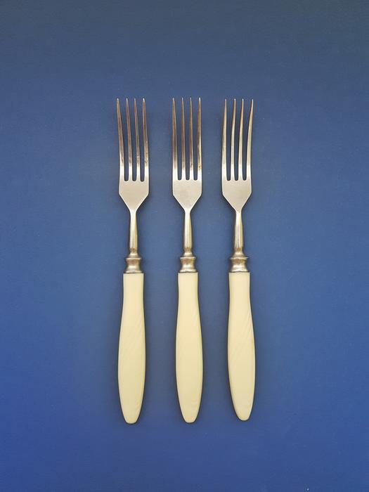 forks on blue background